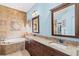 Large bathroom featuring a large vanity, tub, and walk-in shower at 4173 Westbourne Cir, Sarasota, FL 34238