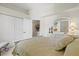 Bedroom featuring a large closet, adjacent bathroom entrance, and comfortable decor, offering convenience and style at 4173 Westbourne Cir, Sarasota, FL 34238