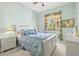 Well-lit bedroom with a window, complemented by matching nightstands and a ceiling fan, creating a serene retreat at 4173 Westbourne Cir, Sarasota, FL 34238