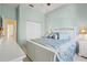 Bright bedroom with a large closet, complemented by matching nightstands, creating a serene and organized space at 4173 Westbourne Cir, Sarasota, FL 34238