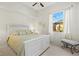 Bright bedroom with a ceiling fan, window with curtains, and stylish decor, creating a relaxing atmosphere at 4173 Westbourne Cir, Sarasota, FL 34238
