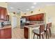 Kitchen area featuring stainless steel appliances and granite countertops with bar stool seating at 4173 Westbourne Cir, Sarasota, FL 34238