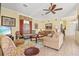 Inviting living room with sofas, floral rug, media center, and a view of the outdoor scenery at 4173 Westbourne Cir, Sarasota, FL 34238
