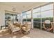 Screened patio with outdoor dining furniture, providing a comfortable space for enjoying meals and the outdoors at 4173 Westbourne Cir, Sarasota, FL 34238