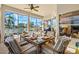 Enclosed patio overlooking a tranquil lake view, perfect for dining and relaxation at 4173 Westbourne Cir, Sarasota, FL 34238