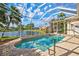 Beautiful screened pool with handrail and brick pavers overlooking the lake at 4173 Westbourne Cir, Sarasota, FL 34238