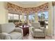 Sitting area with water views and ample natural light at 4173 Westbourne Cir, Sarasota, FL 34238