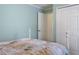 Comfortable bedroom featuring seaside themed bedding and decor, plus bright white closet doors at 4211 73Rd E Ter, Sarasota, FL 34243