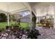 Outdoor patio featuring a dining set with lovely views of the green yard at 4211 73Rd E Ter, Sarasota, FL 34243