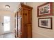 Well-lit entryway with a decorative wood armoire at 4211 73Rd E Ter, Sarasota, FL 34243
