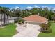 Beautiful property featuring an attached two-car garage, lush lawn, and a screened-in pool in the backyard at 4211 73Rd E Ter, Sarasota, FL 34243