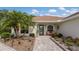 Inviting front entrance with stone pathway and landscaping at 4211 73Rd E Ter, Sarasota, FL 34243