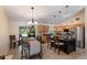 Bright eat-in kitchen boasts granite counters, stainless appliances, and a seamless transition to the outdoor space at 4211 73Rd E Ter, Sarasota, FL 34243