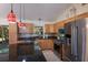 Kitchen features granite countertops, stainless steel appliances, and a large center island perfect for entertaining at 4211 73Rd E Ter, Sarasota, FL 34243