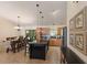 Spacious kitchen featuring an island with barstool seating, stainless steel appliances, and a dining area at 4211 73Rd E Ter, Sarasota, FL 34243