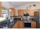 Kitchen features granite countertops, stainless steel appliances, and ample natural light from the window above the sink at 4211 73Rd E Ter, Sarasota, FL 34243