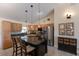 Kitchen showcases custom cabinetry, granite countertops, a large island, and modern stainless steel appliances at 4211 73Rd E Ter, Sarasota, FL 34243