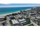 Breathtaking aerial view showcases a beachfront community with convenient parking and easy access to the turquoise waters at 4307 Gulf Dr # 109, Holmes Beach, FL 34217