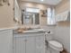 Charming bathroom with wainscoting, decor, and granite vanity at 4307 Gulf Dr # 109, Holmes Beach, FL 34217