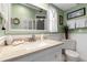 Well-lit bathroom featuring a vanity with lots of counter space, tiled floors, and a large mirror at 4307 Gulf Dr # 109, Holmes Beach, FL 34217