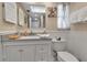 Charming bathroom with wainscoting, decor, and granite vanity at 4307 Gulf Dr # 109, Holmes Beach, FL 34217