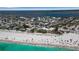 Beautiful beach aerial with turquoise water, white sand, and nearby beach town at 4307 Gulf Dr # 109, Holmes Beach, FL 34217