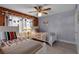 Cozy bedroom featuring twin beds, nautical decorations, wood paneling, and ceiling fan at 4307 Gulf Dr # 109, Holmes Beach, FL 34217