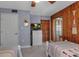 Bedroom with twin beds, wood paneling, closet, a dresser, and TV at 4307 Gulf Dr # 109, Holmes Beach, FL 34217