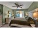 A comfortable bedroom featuring tile flooring and sliding doors that let in plenty of natural light at 4307 Gulf Dr # 109, Holmes Beach, FL 34217