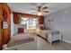Charming bedroom with twin beds, nautical decor, and a ceiling fan at 4307 Gulf Dr # 109, Holmes Beach, FL 34217