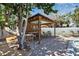 Community cabana with ceiling fan and tables, perfect for relaxing by the pool at 4307 Gulf Dr # 109, Holmes Beach, FL 34217