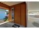 Welcoming entrance featuring a well-lit covered parking, exterior door, and landscaping at 4307 Gulf Dr # 109, Holmes Beach, FL 34217