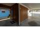 Exterior entrance to unit 109 with covered parking and well-maintained landscaping at 4307 Gulf Dr # 109, Holmes Beach, FL 34217