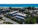 Exterior aerial view of the condominium complex with its parking and proximity to the beach at 4307 Gulf Dr # 109, Holmes Beach, FL 34217