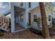 Building exterior showcasing covered walkway, plants, and well-maintained landscaping at 4307 Gulf Dr # 109, Holmes Beach, FL 34217
