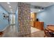 Hallway with stone pillar, leading to entry and kitchen at 4307 Gulf Dr # 109, Holmes Beach, FL 34217