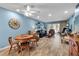 Spacious living room with coastal decor, dining area, and outdoor access at 4307 Gulf Dr # 109, Holmes Beach, FL 34217