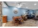 Living room with dining area, stone accent wall, and nautical decor at 4307 Gulf Dr # 109, Holmes Beach, FL 34217