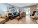 Comfortable living room with fireplace, decor, comfortable furniture, light blue walls, and wood floors at 4307 Gulf Dr # 109, Holmes Beach, FL 34217