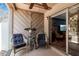 Inviting patio featuring coastal decor, comfortable seating, and access to the interior living space at 4307 Gulf Dr # 109, Holmes Beach, FL 34217
