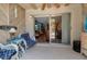Relaxing patio area with comfortable seating, ceiling fan and view to the interior living space at 4307 Gulf Dr # 109, Holmes Beach, FL 34217