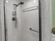 Bright tiled shower with accessible grab bar and shelving at 4307 Gulf Dr # 109, Holmes Beach, FL 34217