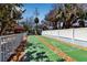 Shuffleboard court with palm trees and a cabana in a well-maintained community at 4307 Gulf Dr # 109, Holmes Beach, FL 34217
