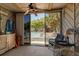 Bright sunroom offers lovely pool views and decor at 4307 Gulf Dr # 109, Holmes Beach, FL 34217