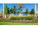 Inviting community entrance sign with lush landscaping, creating a welcoming atmosphere for residents and visitors at 4325 Renwick Dr, Parrish, FL 34219