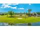Community stage surrounded by lush greenery with a nearby pond, playground, and walking paths for outdoor entertainment at 4325 Renwick Dr, Parrish, FL 34219
