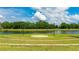 Community stage featuring a brick patio and lake view for outdoor gatherings and community events at 4325 Renwick Dr, Parrish, FL 34219