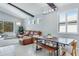 Bright living area with large windows, comfortable seating, and a dining table for gatherings at 4325 Renwick Dr, Parrish, FL 34219
