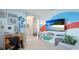 Spacious living room features a TV, neutral decor, and a comfortable seating area for relaxing and entertaining at 4325 Renwick Dr, Parrish, FL 34219