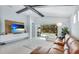 Cozy living room with backyard pool views and media center; perfect for relaxing and entertaining at 4325 Renwick Dr, Parrish, FL 34219